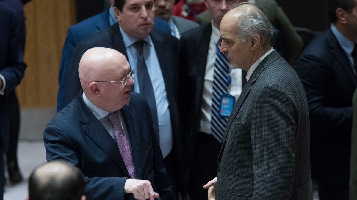 Russian Ambassador to the United Nations Vassily Nebenzia, left, speaks to Syrian Ambassador to the United Nations Bashar al-Jaafari in the Security Council chambers.-AP 