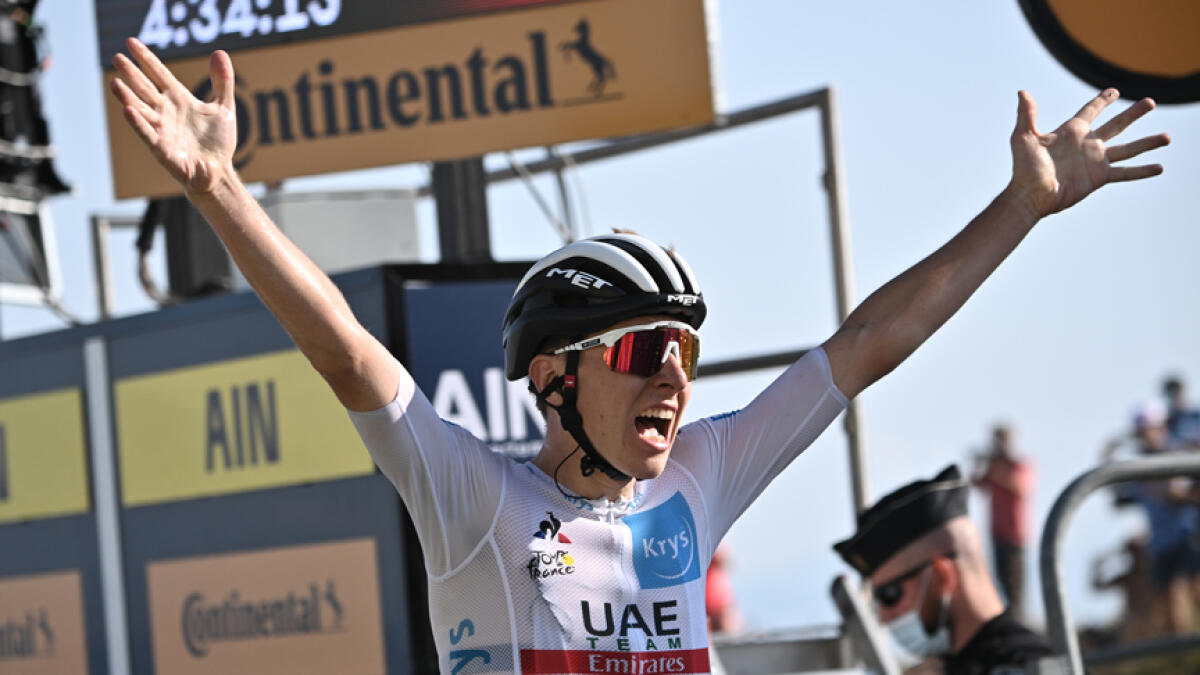 UAE Team Emirates' Tadej Pogacar celebrates after winning the 15th stage of the Tour de France on Sunday. - Reuters