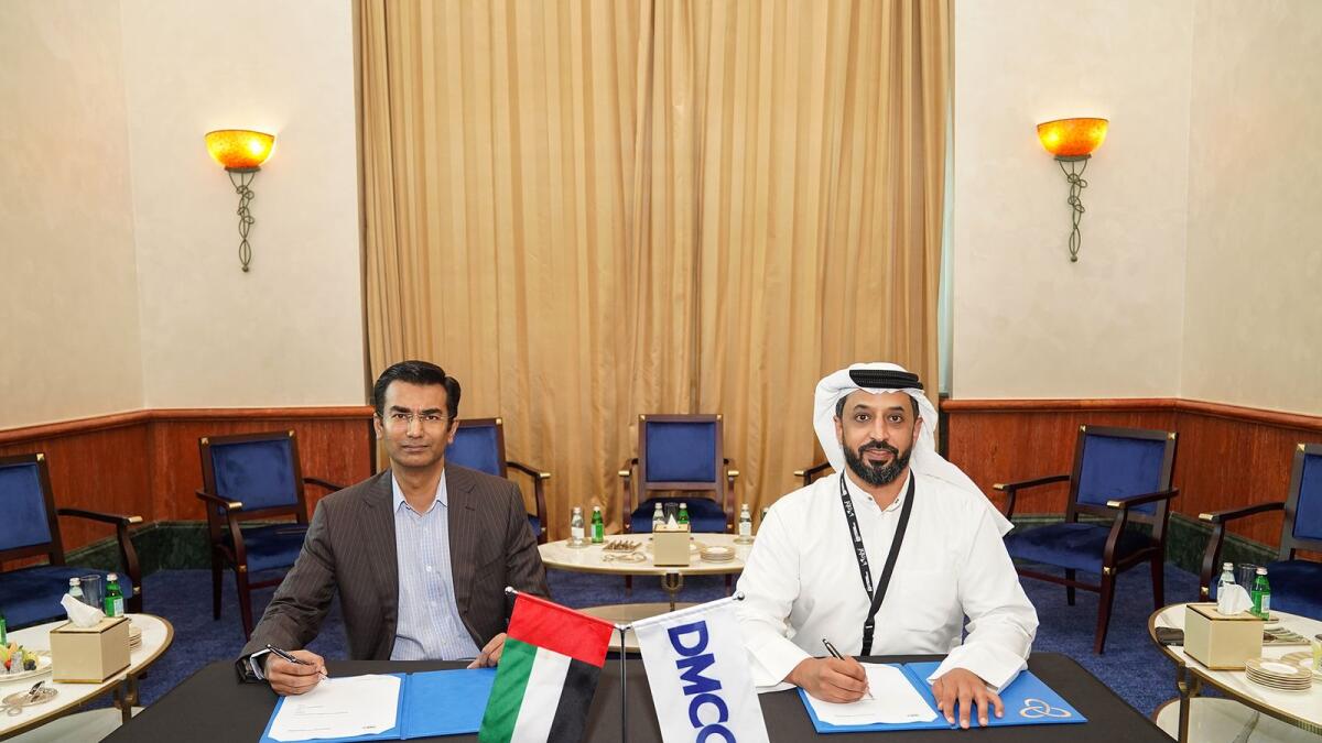 Gaurav Mathur, founder and managing director, SafeGold, Ahmed bin Sulayem, executive chairman and CEO, DMCC, signing the agreement. — Supplied photo