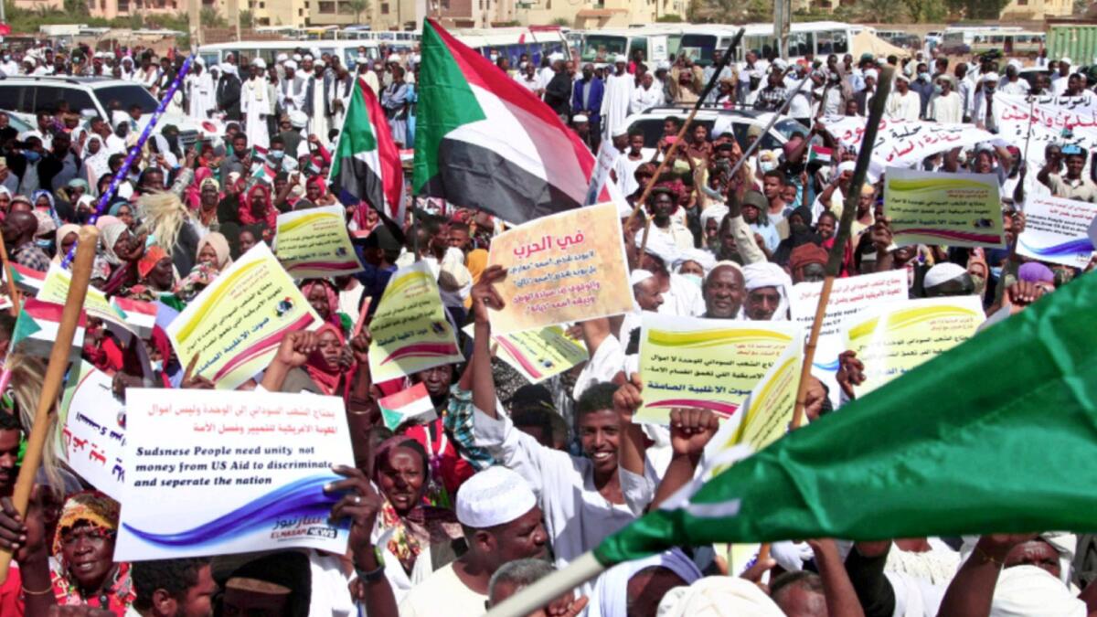 Supporters of the Sudanese army rally outside the office of the United Nations mission. — AFP