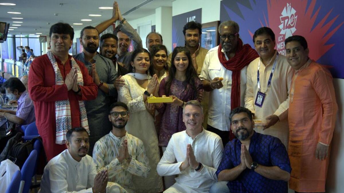 Sir Clive Lloyd (third from right, second row), Ajay Sethi (second from right, second row) and other members of the Talk 100.3 team celebrated Diwali at the press box of the Dubai International Cricket Stadium on Thursday. (Supplied photo)