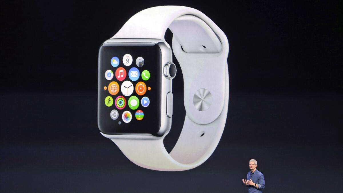 Apple CEO Tim Cook introduces the new Apple Watch in 2014. — AP file