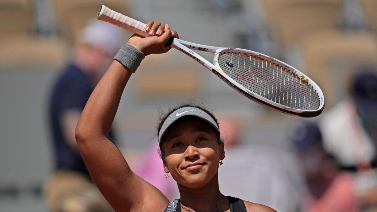 Japan's Naomi Osaka celebrates after defeating Romania's Patricia Maria Tig during their first round match of the French Open. — AP