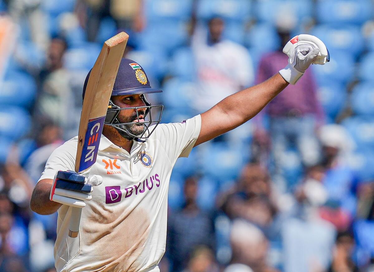 Indian captain Rohit Sharma celebrates his century during the second day of the first Test against Australia in Nagpur. — PTI