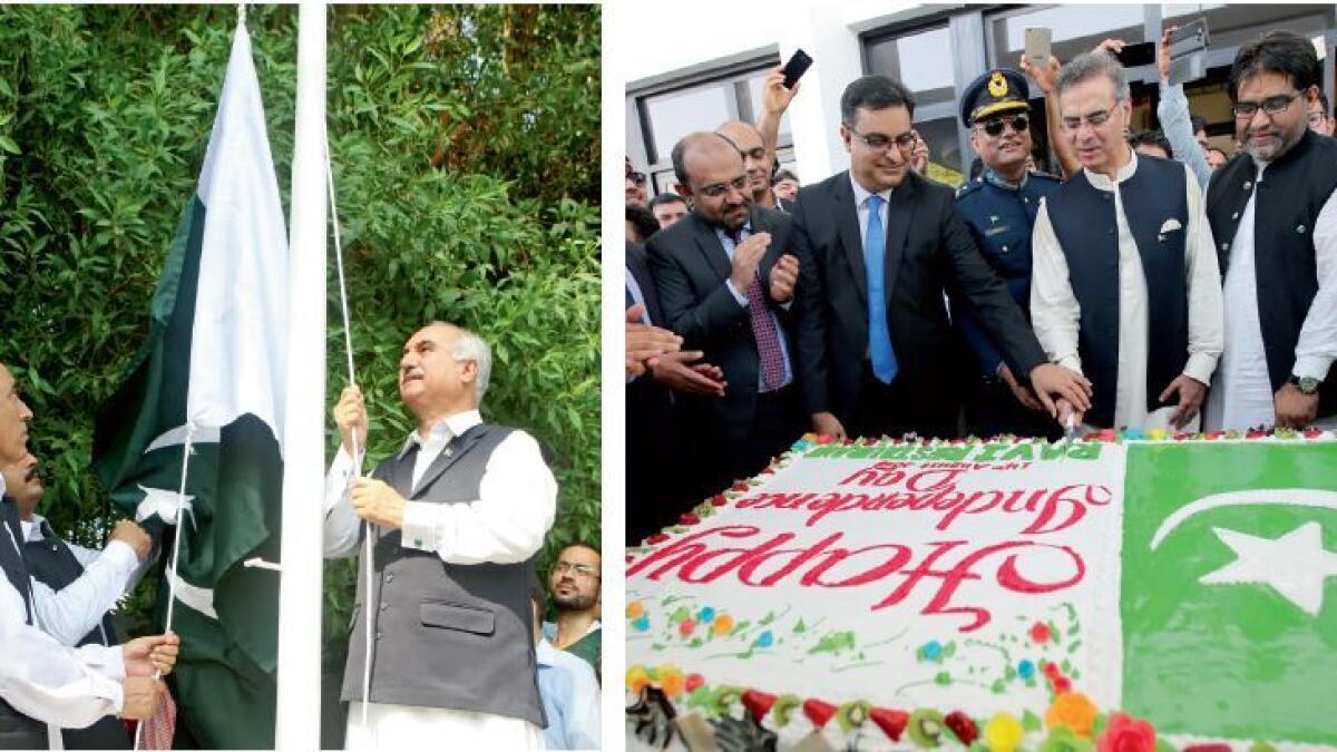 Brig (Rtd) Syed Javed Hassan (right) hoists the Pakistan national flag during the Independence Day celebrations at the consulate in Dubai and, right,  Moazzam Ahmad Khan cuts a cake at the embassy in Abu Dhabi. — Photos by Mohammed Mustafa Khan and Ryan L