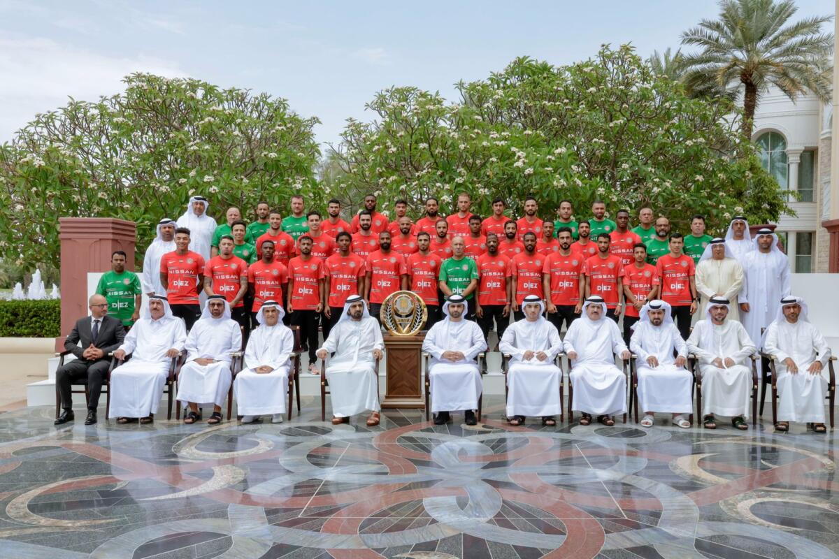 Sheikh Mohammed with the players of Shabab AlAhli Dubai Football Club.