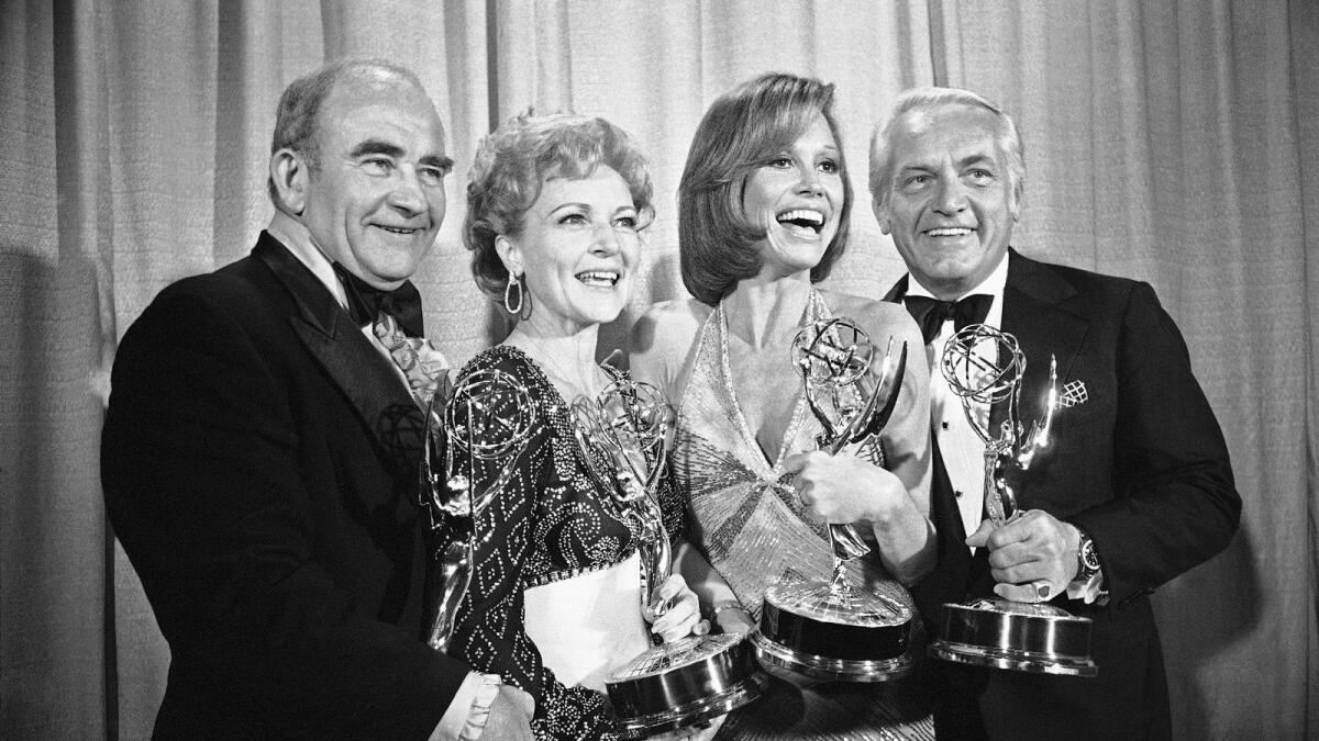 In this May 18, 1976 file photo, cast members of the Mary Tyler Moore Show pose with their Emmys backstage