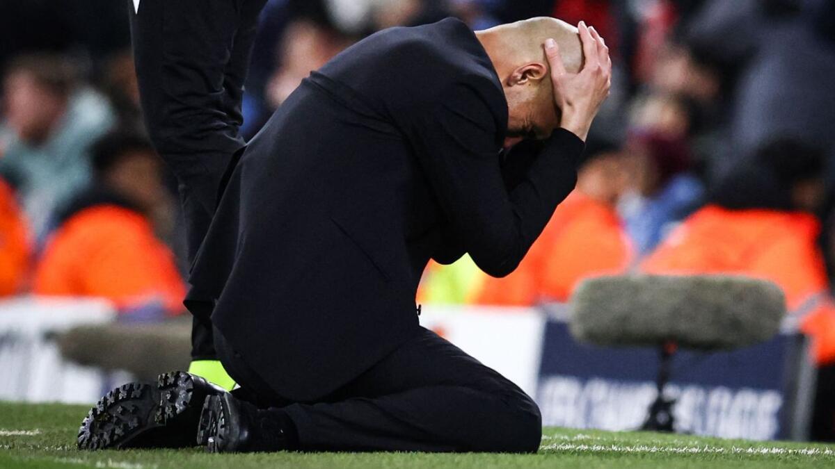 Manchester City's Spanish manager Pep Guardiola reacts following a missed penaltyduring the UEFA Champions League. - AFP
