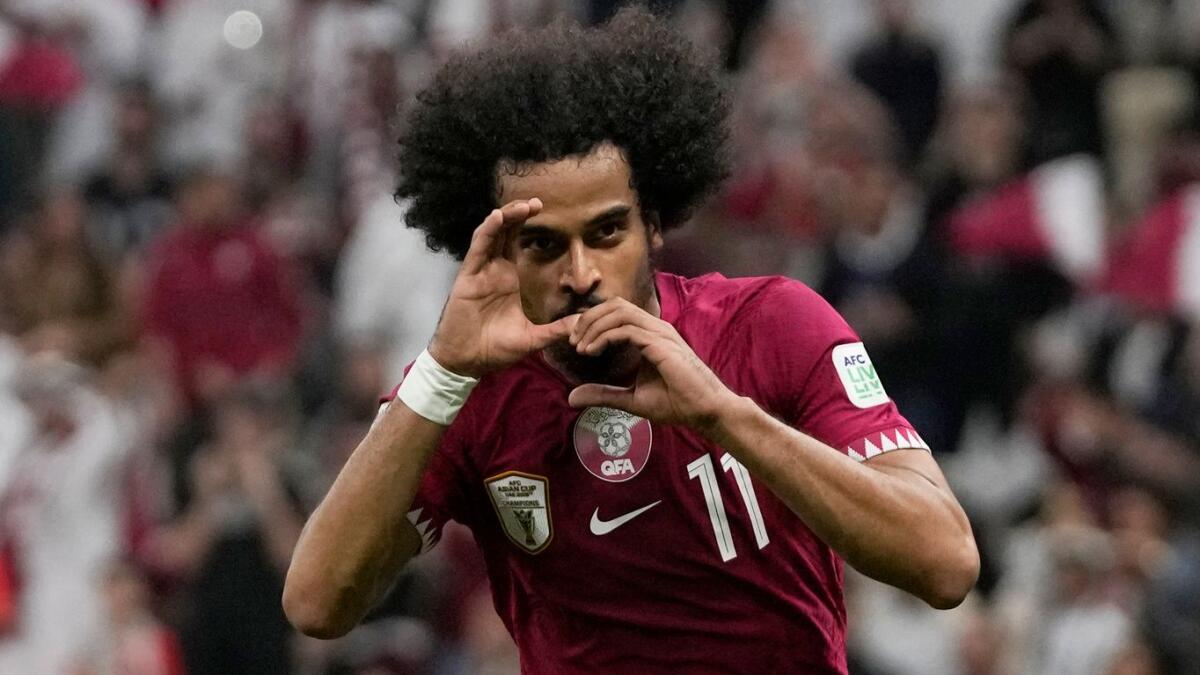 Qatar's Akram Afif celebrates after scoring the opening goal during the Asian Cup Group A match against Lebanon at the Lusail Stadium in Lusail, Qatar. - AP