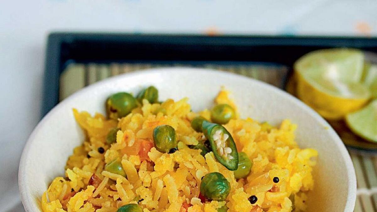 Poha,an Indian breakfast of rice flakes with spices and vegetables