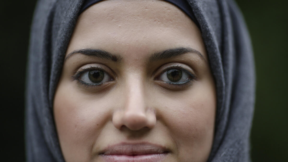 In this Tuesday, Oct. 13, 2015 photo Syrian refugee Reem Habashieh poses for a photo during an interview with the Associated Press at a park in Pirna, Germany. (AP Photo)