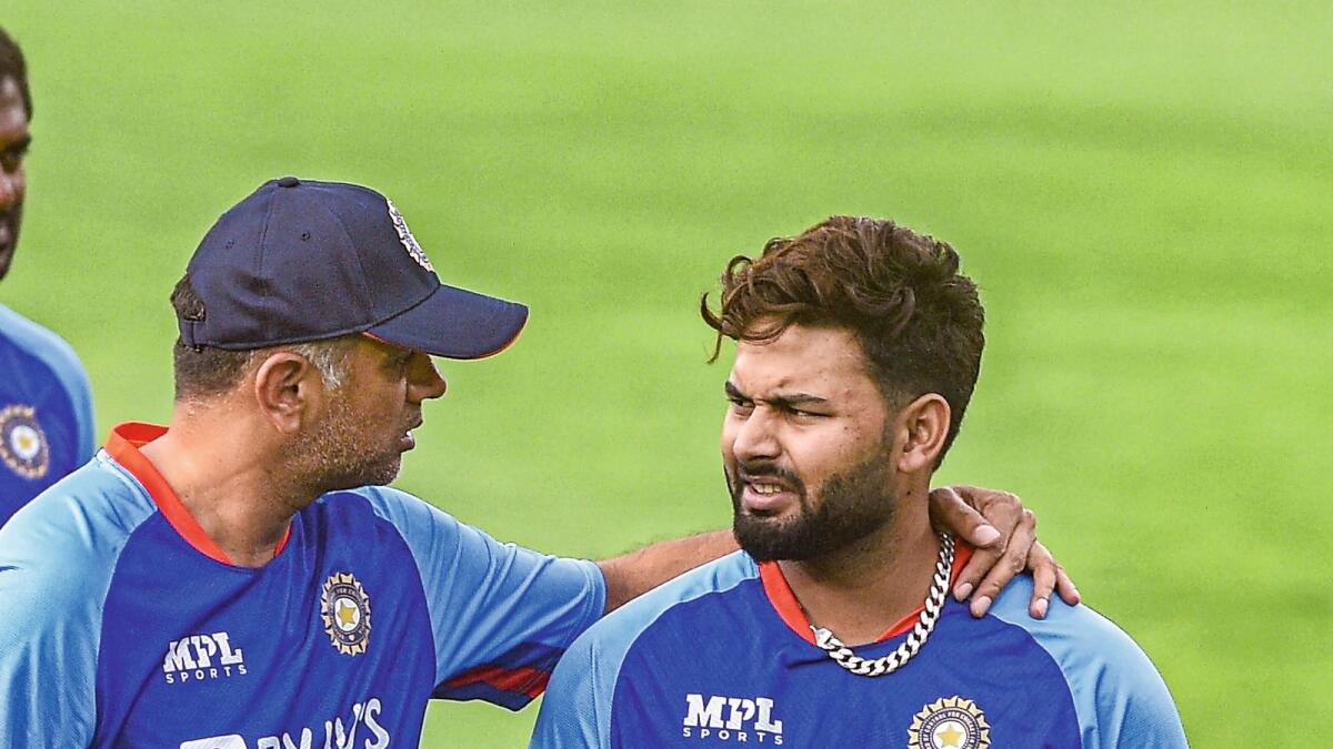 Indian coach Rahul Dravid (left) speaks to captain Rishabh Pant during a practice session. — PTI