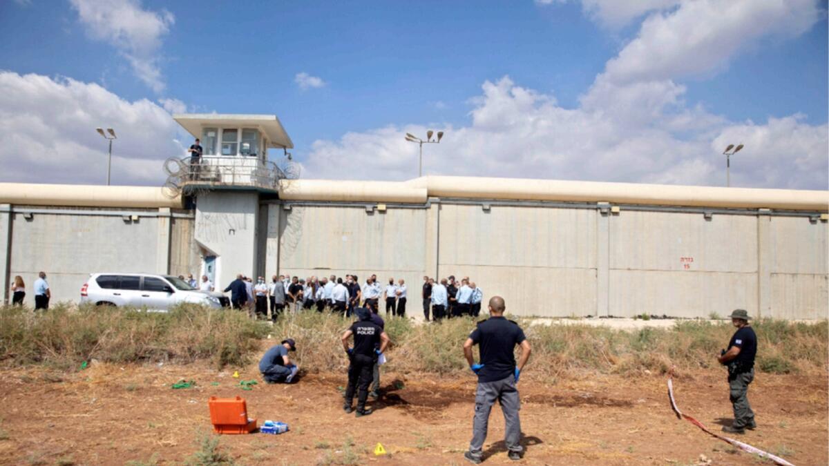 Police officers and prison guards inspect the scene of a prison escape outside the Gilboa prison in Northern Israel. — AP