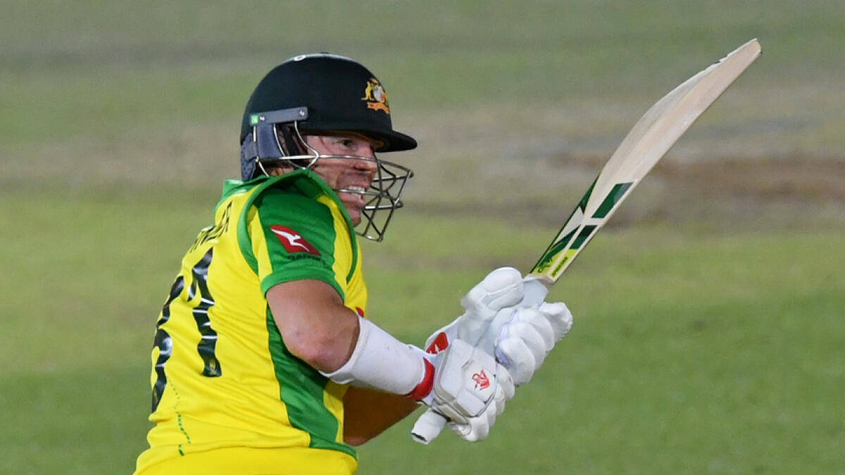 David Warner plays a shot during the first international Twenty20 cricket match between England and Australia. - Reuters