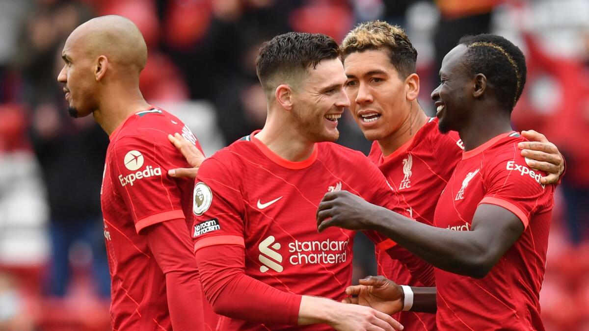 Liverpool's Sadio Mane (right) celebrates his goal with teammates during the English Premier League match against Crystal Palace at Anfield stadium. — AP