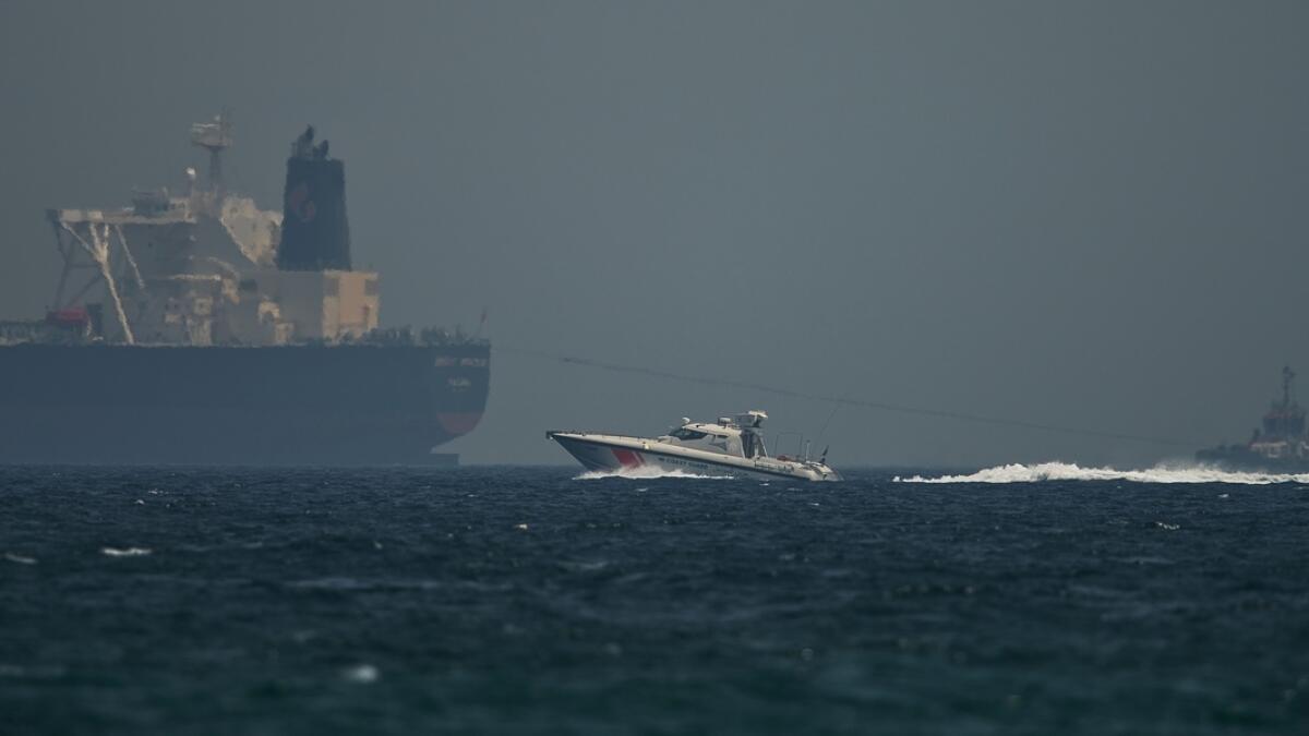 An Emirati coast guard vessel passes an oil tanker off the coast of Fujairah, United Arab Emirates.- AP