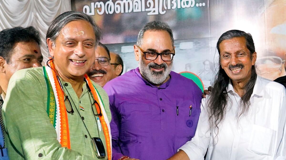 Shashi Tharoor, Rajeev Chandrasekhar and Pannyan Raveendran during a programme in Thiruvananthapuram. — File photo