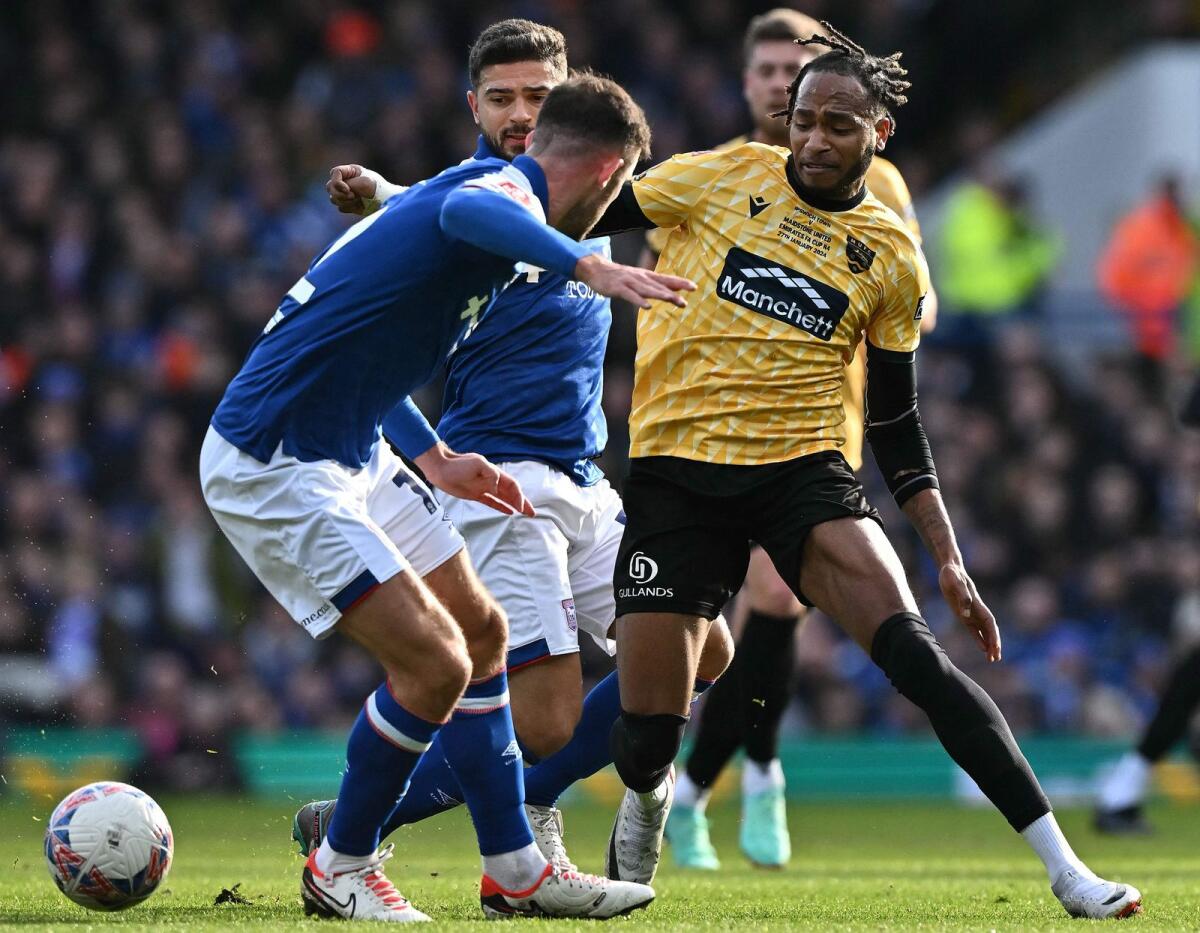Maidstone's Jamaican striker Lamar Reynolds (R) vies with Ipswich Town's English-born Egyptian midfielder Sam Morsy during the English FA Cup fourth round match on Saturday. - AFP