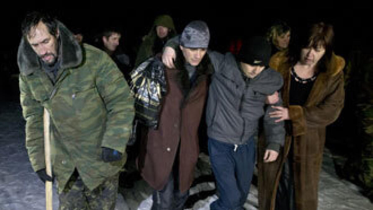 In dead of night, Ukraine’s warring sides swap prisoners