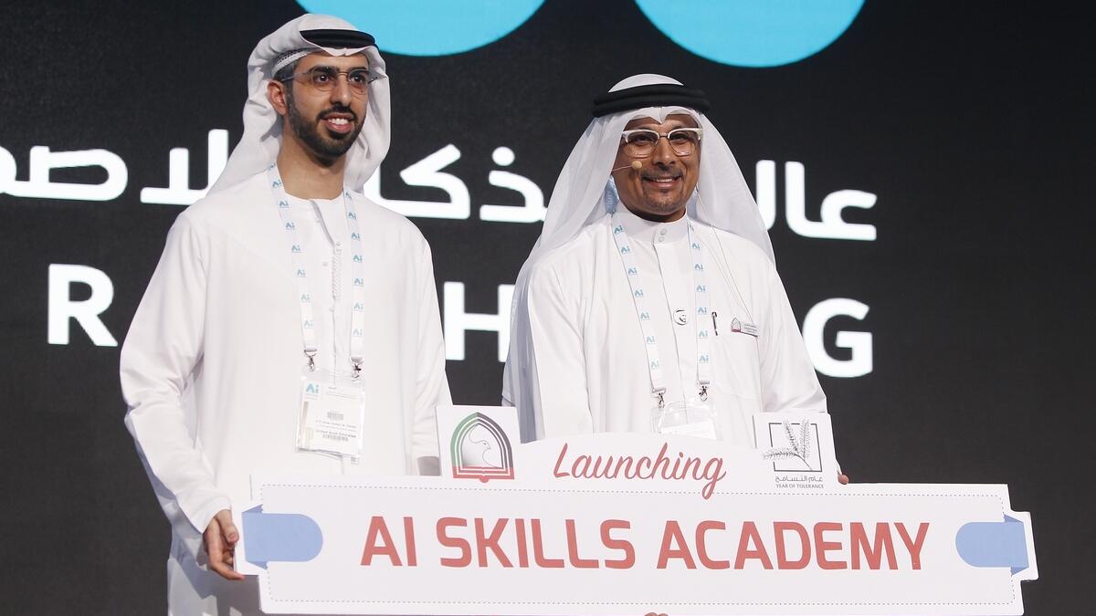 Omar bin Sultan Al Olama, Minister of State for Artificial Intelligence with Dr Abdullatif M.Al Shamsi, president and ceo of Higher Colleges of Technology during the launch of AI Skills academy at the AI Everything Summit at DWTC. -Photo by Juidin Bernarr