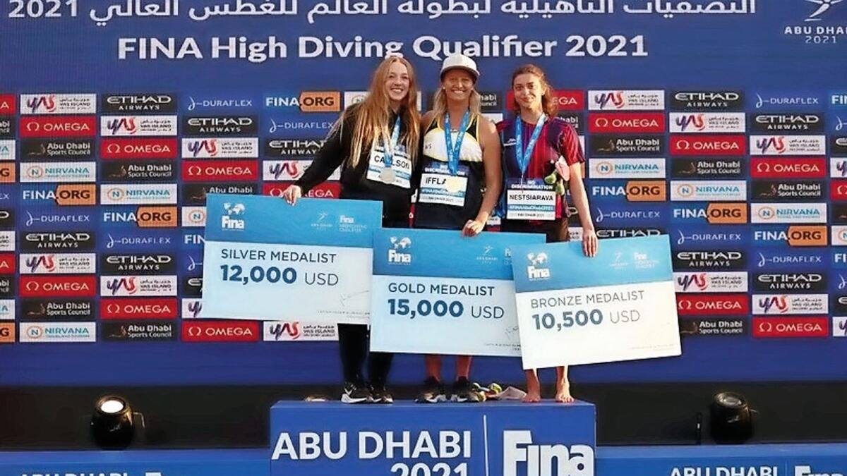 Podium finish: Rhiannan Iffland (centre) of Australia celebrates after winningthe gold in Abu Dhabi on Monday. — AP