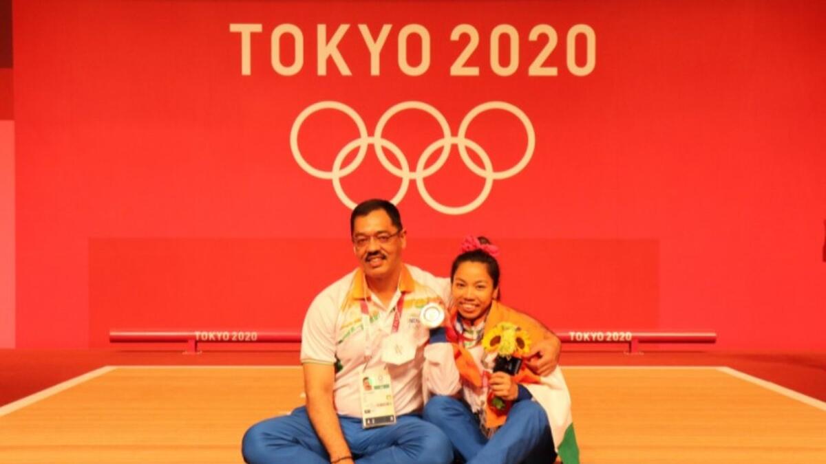 Indian weightlifter Mirabai Chanu with her coach after winning the silver medal. (Twitter)