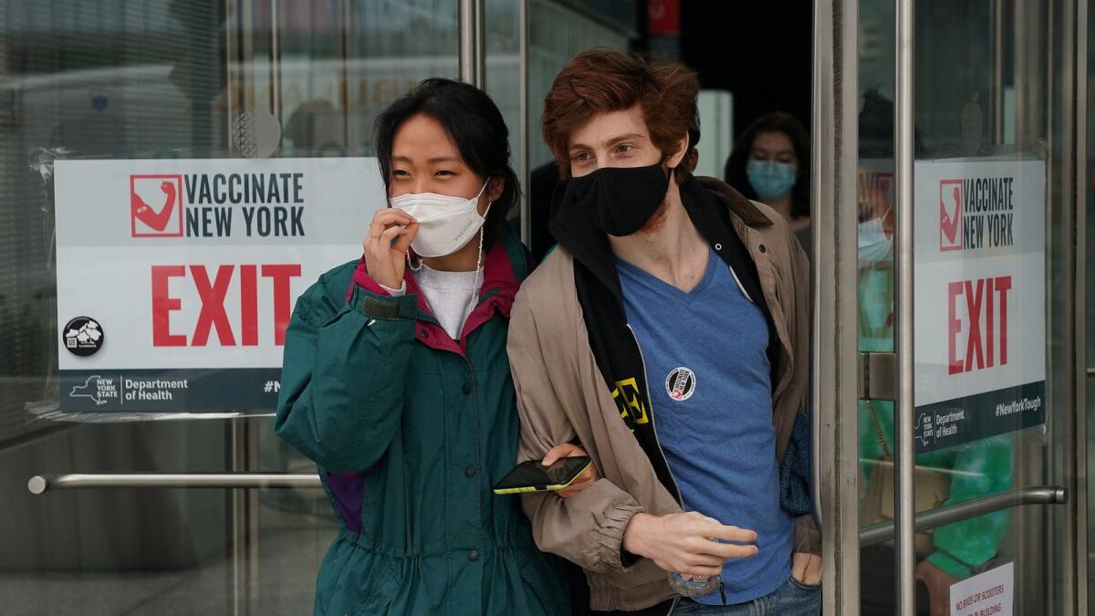 People leave after receiving their vaccine at a Covid-19 vaccination center in New York. Photo: AFP