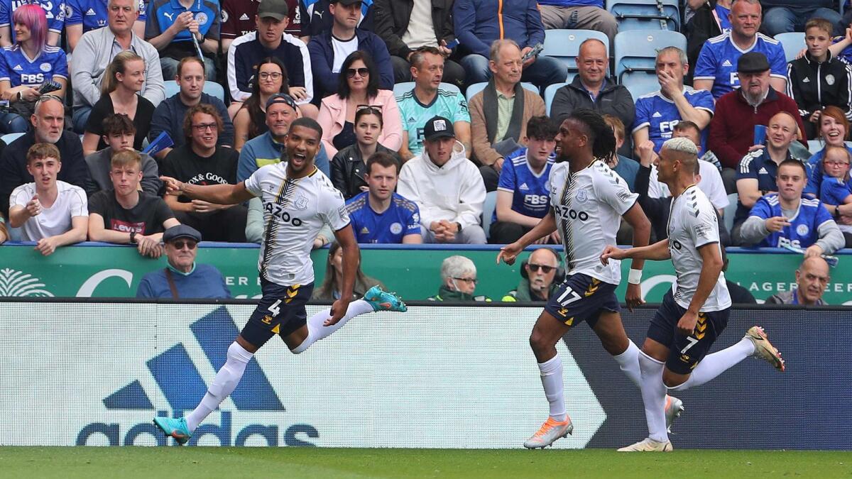 Everton's English defender Mason Holgate (left) celebrates scoring the team's second goal. (AFP)