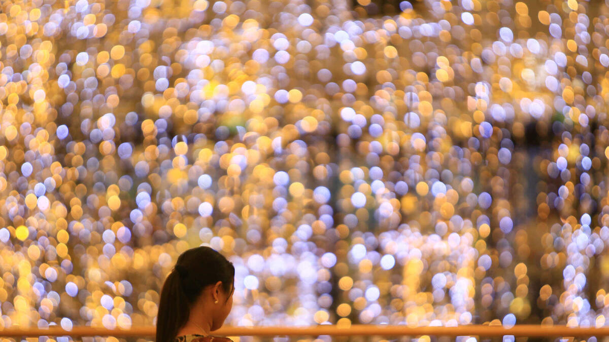 People looking at a decoration made of lights at a mall in Dubai.- Photos By Neeraj Murali/Khaleej Times