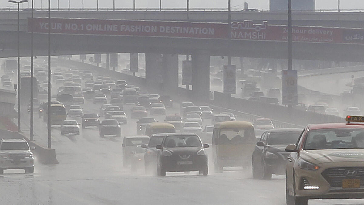Motorists slow down as a light rain shower descends on Sheikh Zayed Road in Dubai.-Photo by Juidin Bernarrd/Khaleej Times