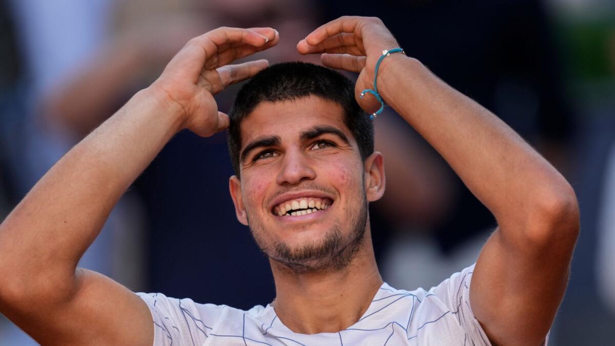 Carlos Alcaraz celebrates after beating his idol Rafael Nadal. (AP)