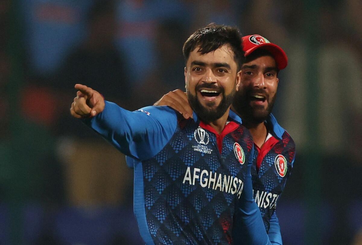 Afghanistan's Rashid Khan celebrates after taking a wicket. - Reuters