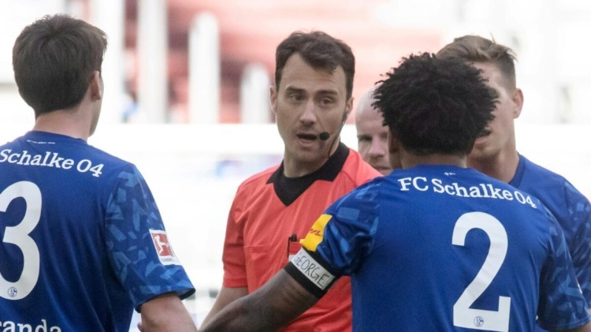 Schalke's US midfielder Weston McKennie (right) wears an armband reading 'Justice for George' during Saturday's defeat to Werder Bremen. - AFP