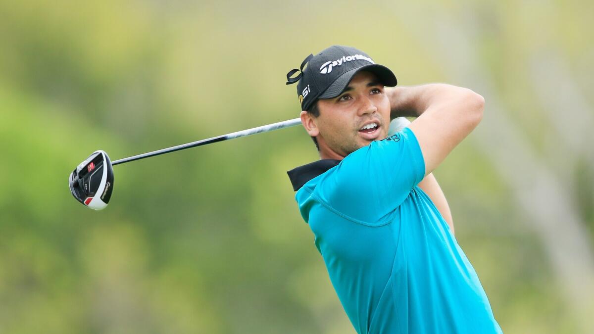 Day wins match, injures back in WGC-Dell opener