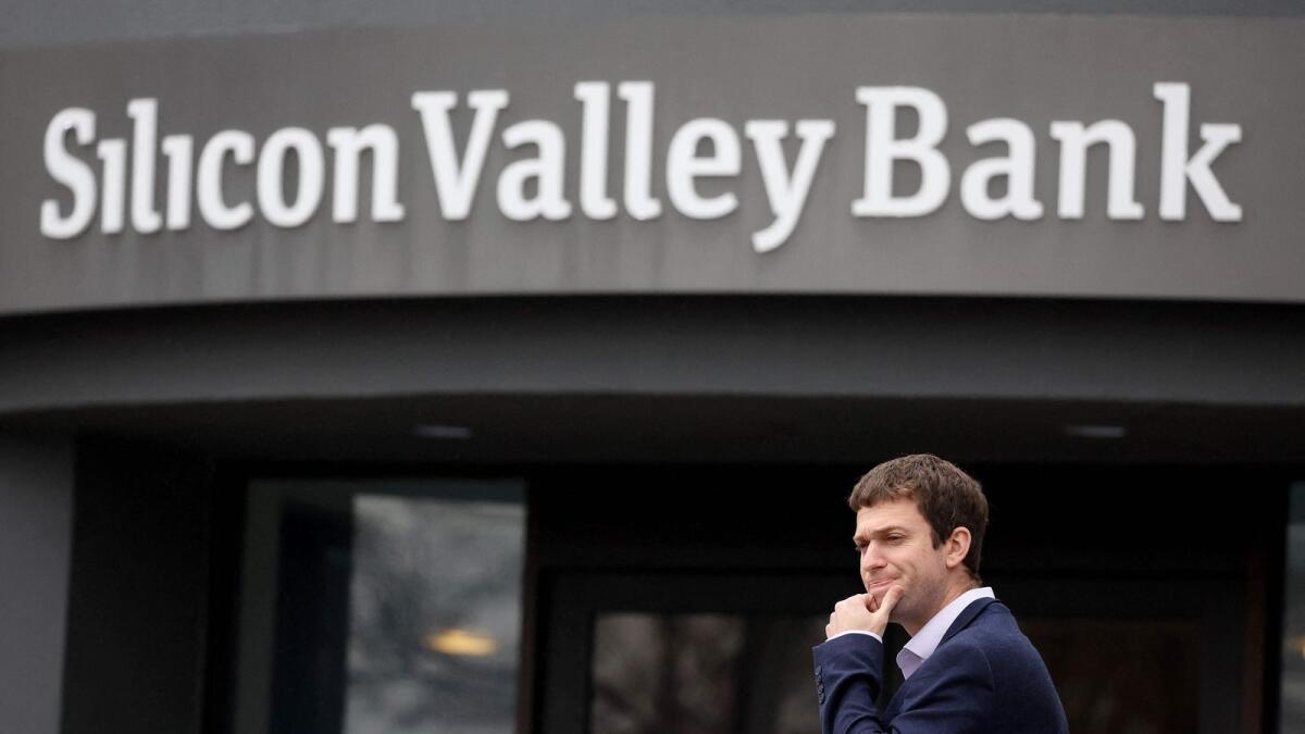 A customer stands outside of a shuttered Silicon Valley Bank (SVB) headquarters in Santa Clara, California. — AFP
