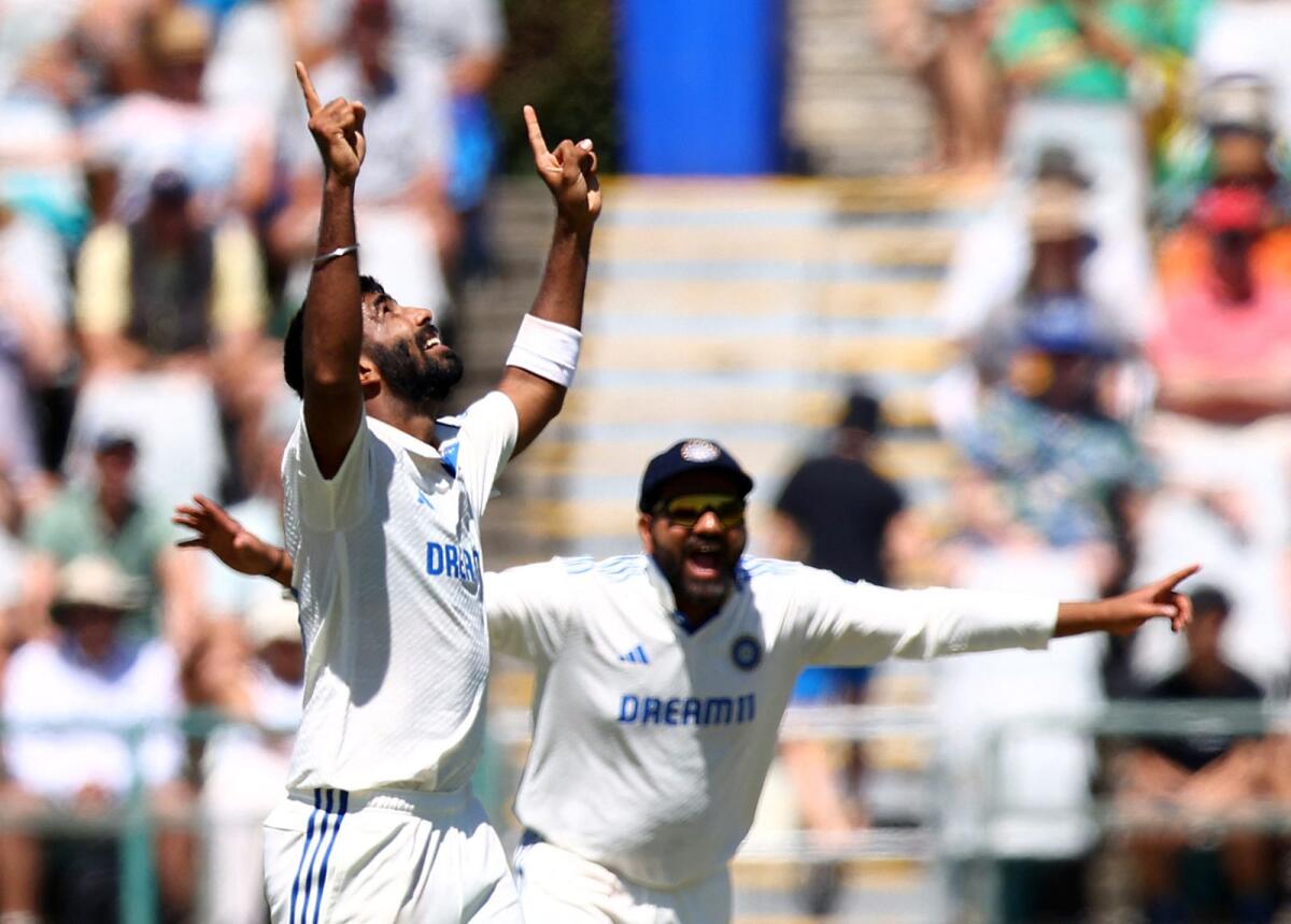India's Jasprit Bumrah (left) celebrates taking the wicket of South Africa's Keshav Maharaj. — Reuters