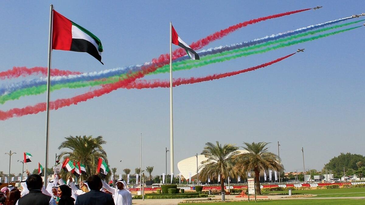 A mesmerising performance by the aerobatic team over the Union House in Dubai displaying the colours of the UAE flag as part of the UAE Flag Day celebrations on Thursday. — Photo by Juidin Bernarrd