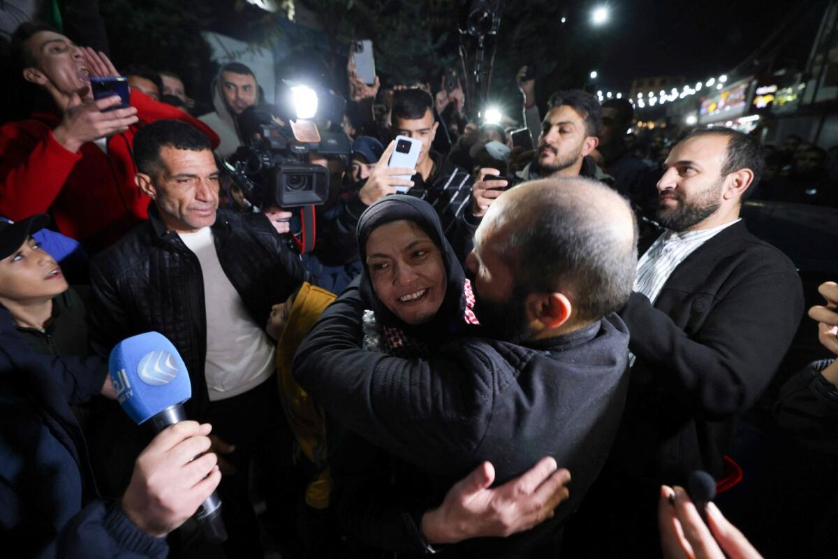 Rawda Abu Ajamieh hugs relatives and friends after her release from an Israeli prison. AFP