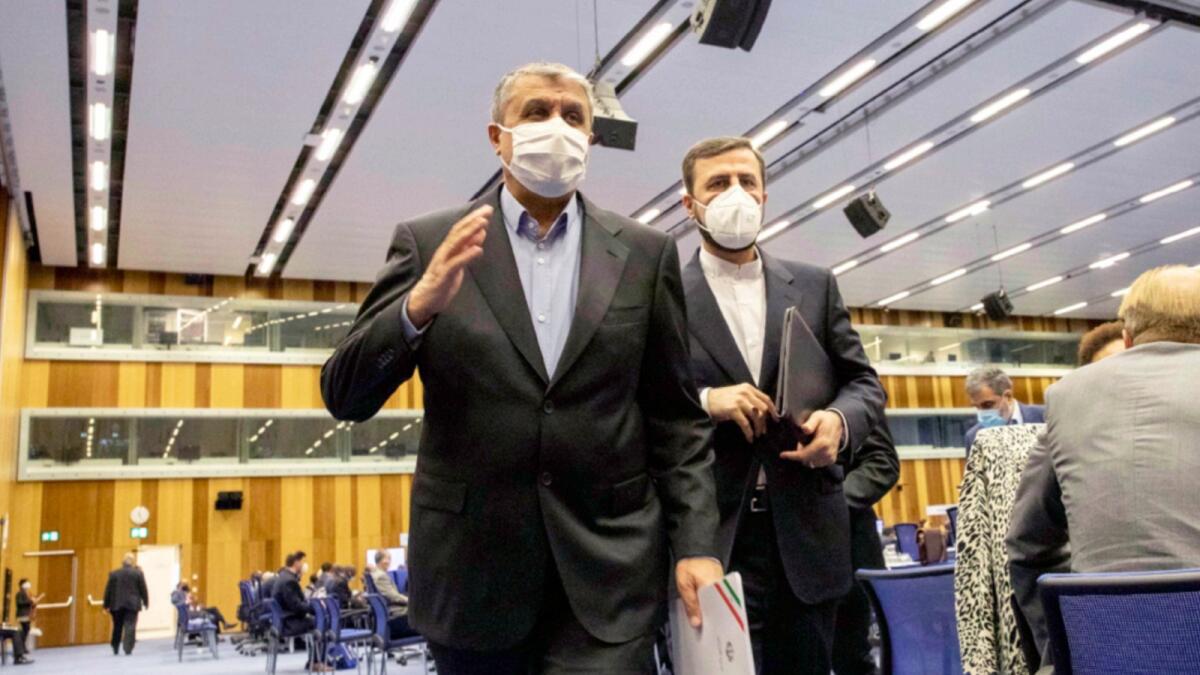 Mohammad Eslami, new head of Iran's nuclear agency (AEOI), and Iran's Governor to the IAEA Kazem Gharib Abadi,  leave the IAEA General Conference in Vienna. — AP file
