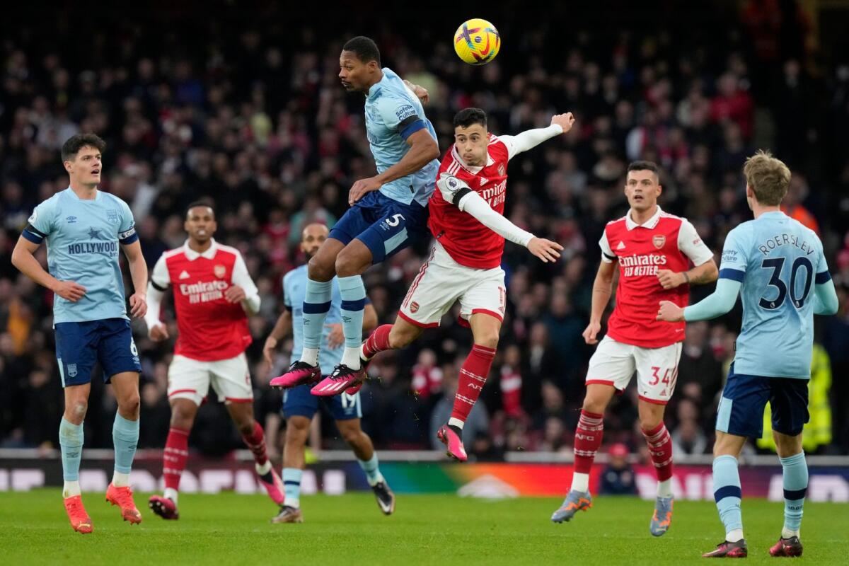 Arsenal's Gabriel Martinelli (centre right) and Brentford's Ethan Pinnock (centre left) challenge for the ball during the Premier League match on Saturday. — AP