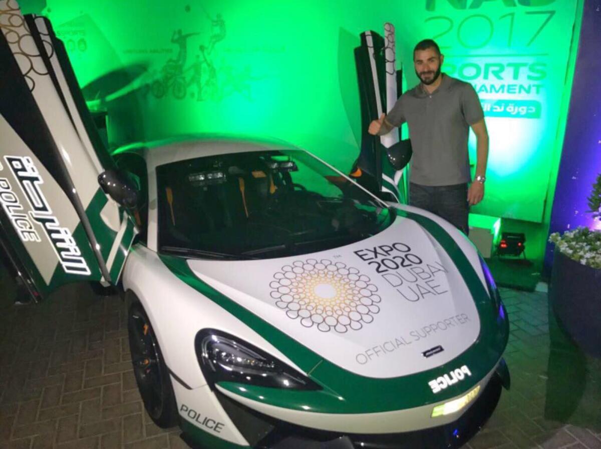 Benzema poses in front of a Dubai Police car. — Dubai Media Office Twitter