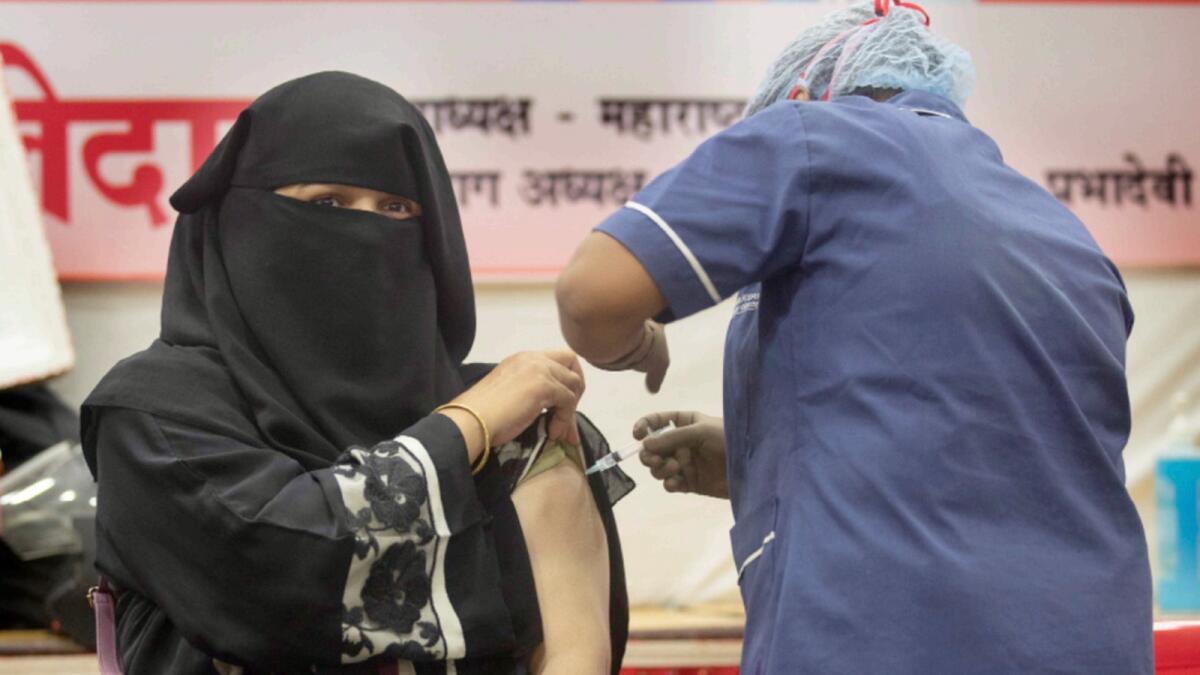 A health worker administers Covid-19 vaccine in Mumbai, India. — AP