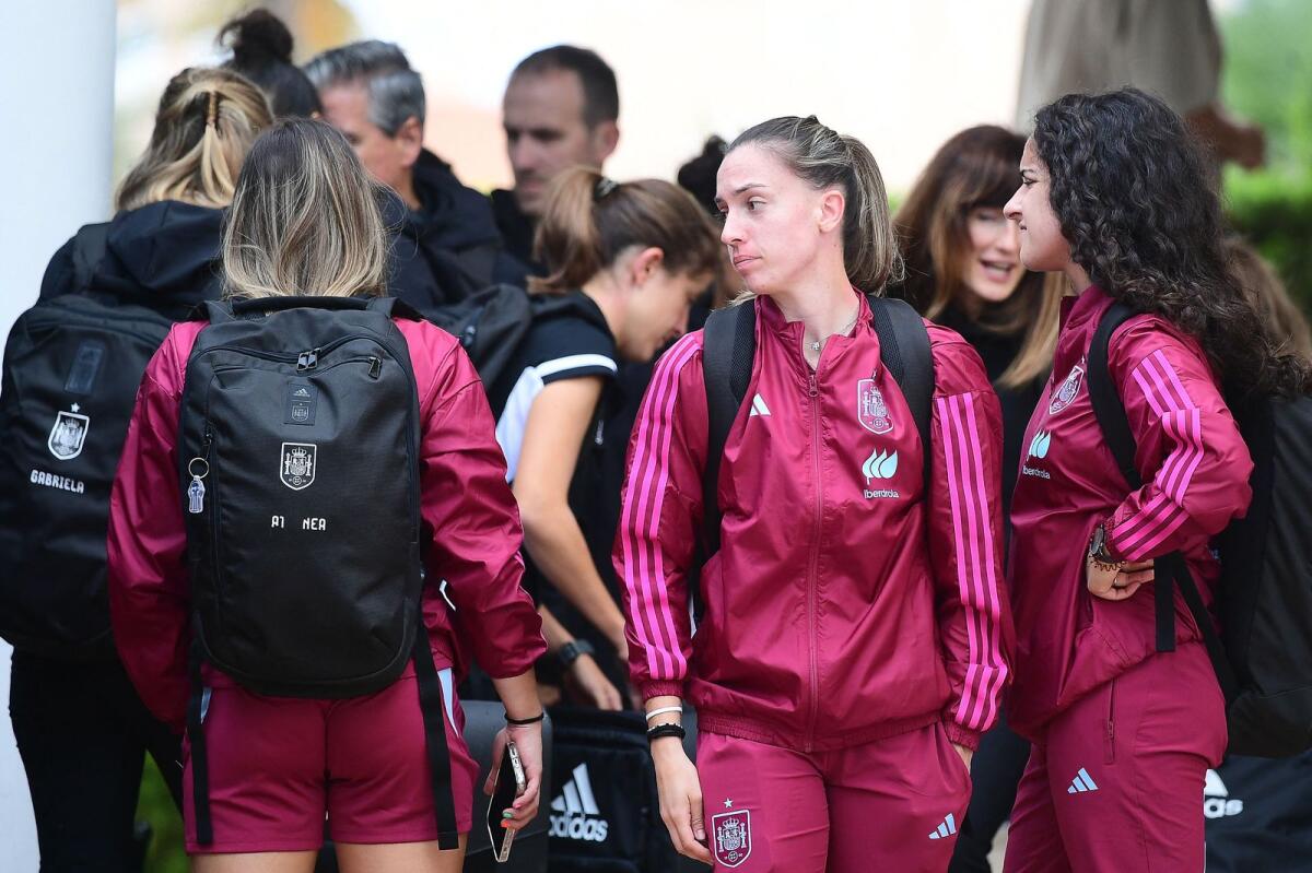 Spain's forward Eva Navarro (centre), defender Ohiane Hernandez and teammates arrive at a hotel in Oliva near Valencia. — AFP