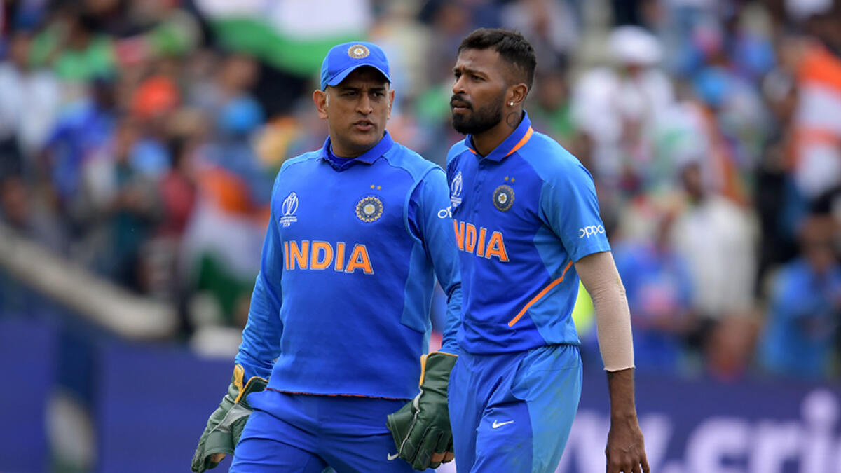 Pandya revealed that MS Dhoni (left) urged him not to bowl a bouncer in the last over. -- AFP