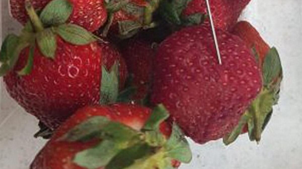 Boy arrested for putting needles in strawberries