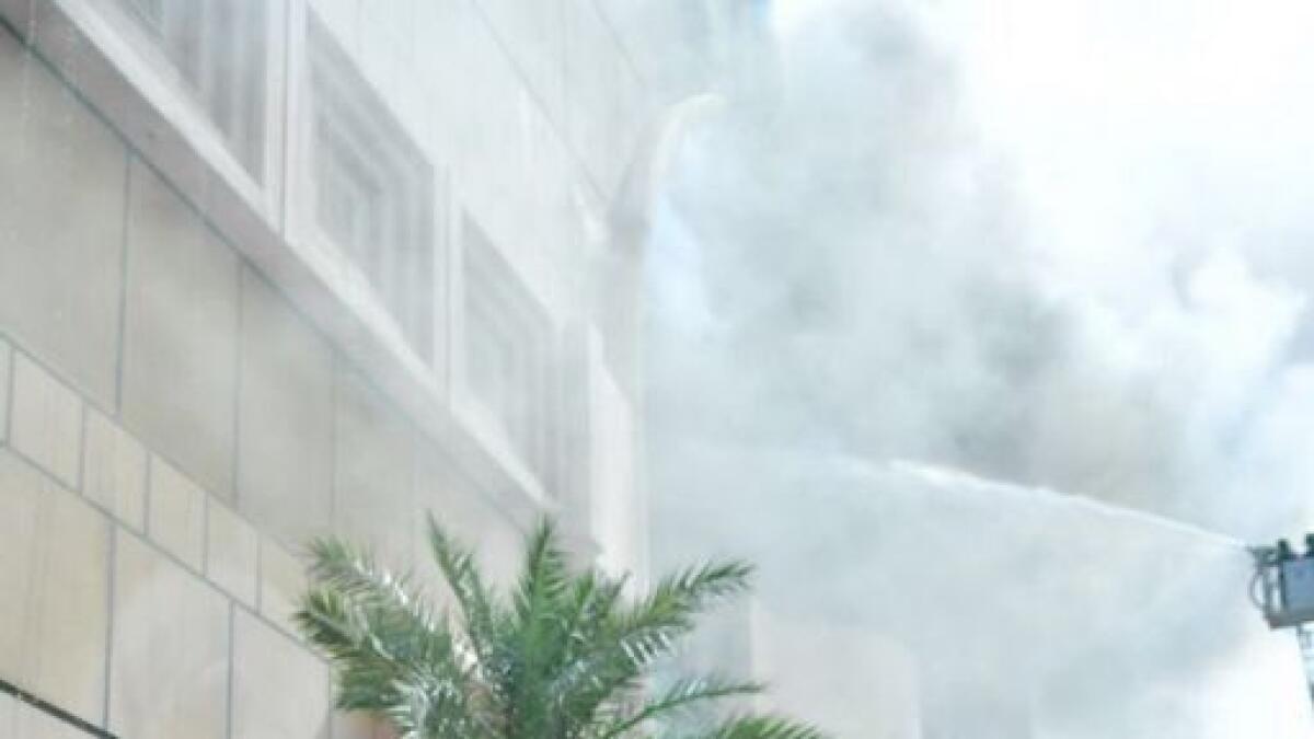 Newly appointed Dubai Police Chief Major-General Abdullah Khalifa Al Marri at the scene of the Lamcy Plaza fire.