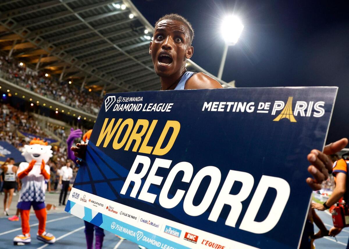 Ethiopia's Lamecha Girma celebrates as he sets a new world record to win the men's 3000m steeplechase. - Reuters