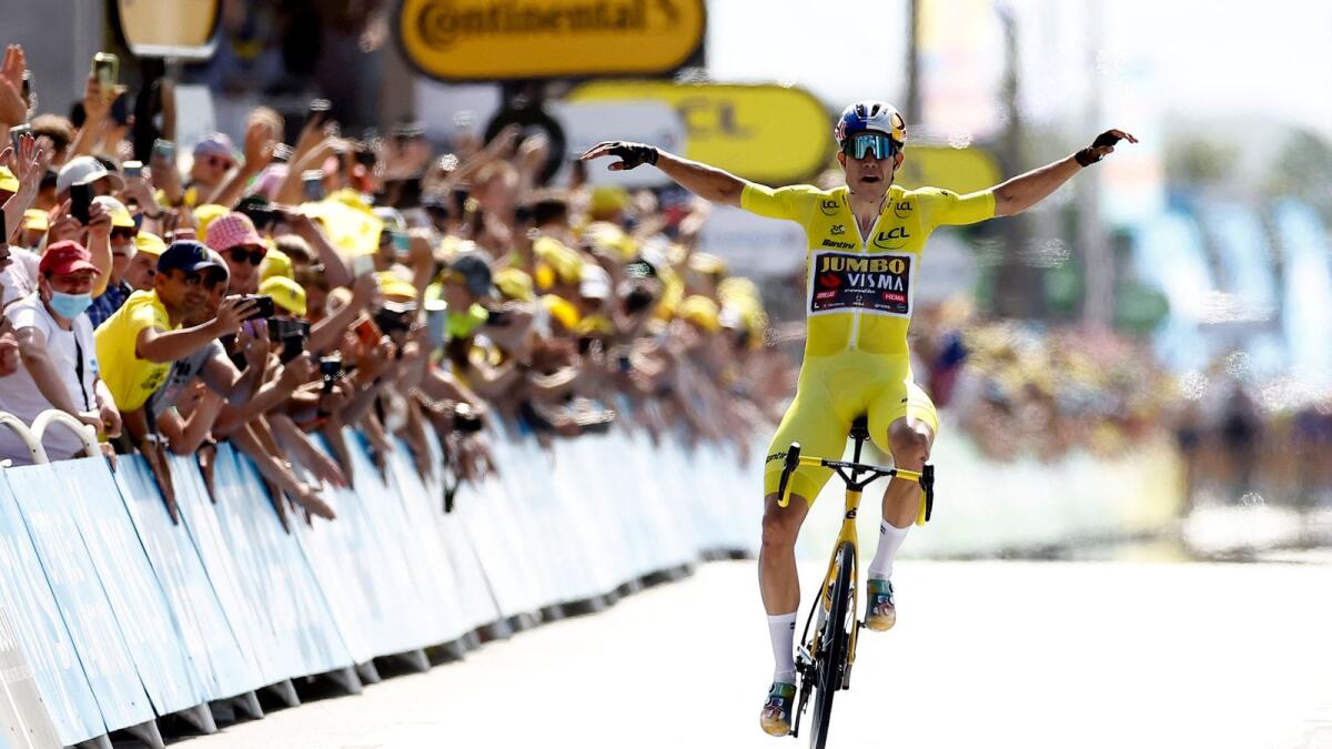Wout Van Aert celebrates as he crosses the finish line to win stage 4. (Reuters)