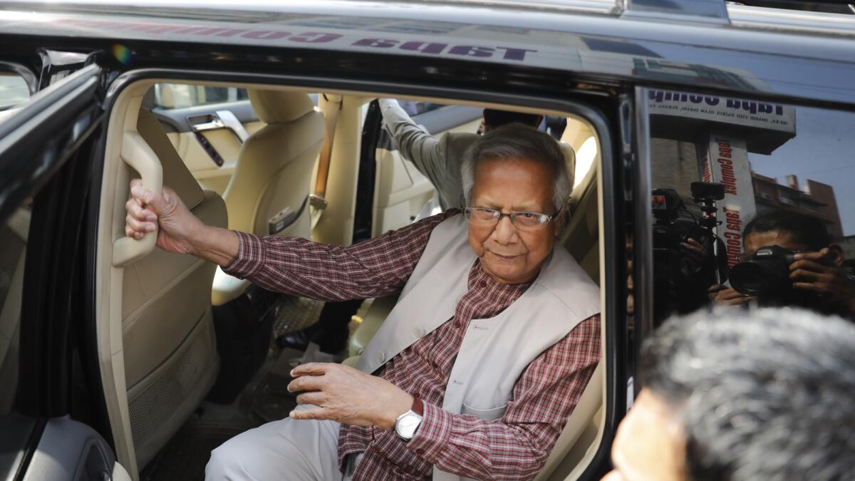 Nobel Peace Prize winner Muhammad Yunus arrives to appear before a labour court in Dhaka. — AP