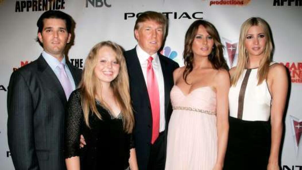 Donald Trump poses with his wife and children Donald Trump Jr.(L), Tiffany Trump (2nd L), Melania (2nd R) and daughter Ivanka at the party following the live telecast of the finale of season five of The Apprentice in Los Angeles, June 5, 2006.
